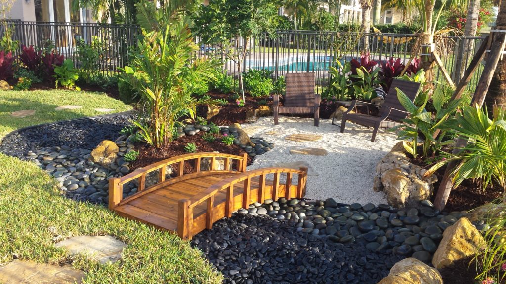 Asian style garden inside a tropical backyard with pool ...