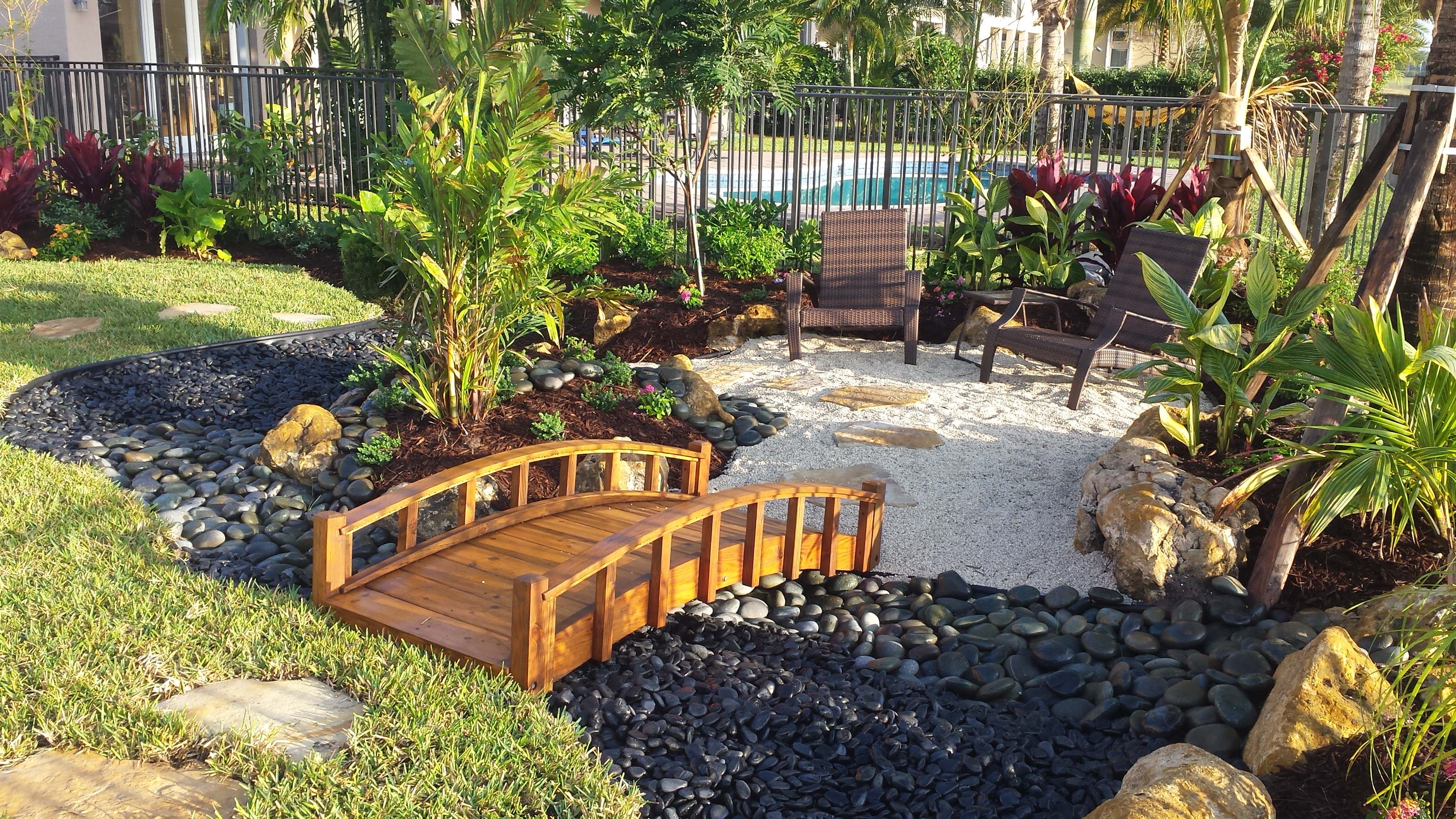garden landscape pool asian tropical stone seating area backyard landscaping beach resort rock water universal side installation swimming plants pools